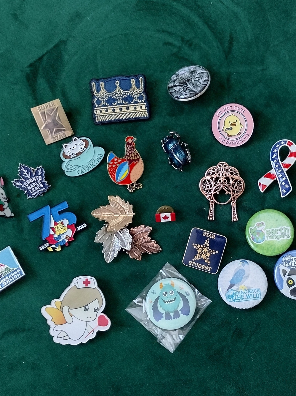 Large Bundle of Assorted Multicolored Brooches and Pins.